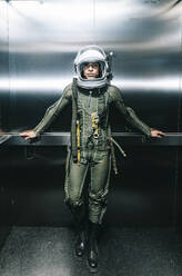 Man posing dressed as an astronaut in an elevator - DAMF00105