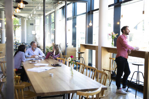 Casual business people having a meeting in a cafe stock photo