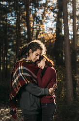 Young couple in love in forest - DAMF00119