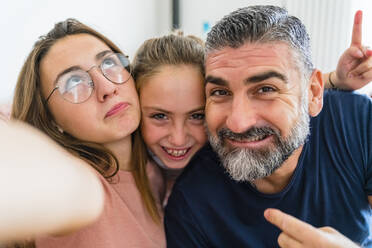 Selfie of happy father with two daughters - MGIF00719