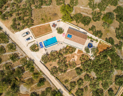 Aerial view of villa with swimming pool, Sumartin, Brac island, Croatia. - AAEF03740