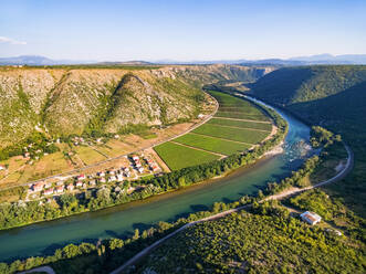 Aerial view of hills and vineyards next to Neretva river in Bosnia and Herzegovina. - AAEF03939