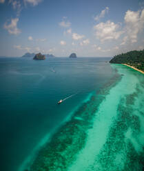 Aerial view of a boats in the paradisiacal sea in Chao Mai National Park in Thailand. - AAEF04054