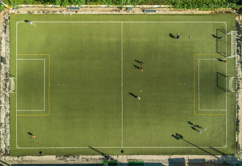 Aerial view of a football training on synthetic surface football pitch on a summer day. stock photo