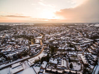 Aerial view of snow cityscape during scenic sunset, Lochem, Netherlands. - AAEF04435