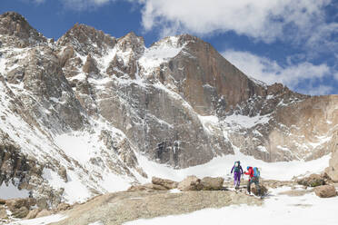 Climbers hike towards Longs Peak in Rocky Mountain National Park - CAVF63458