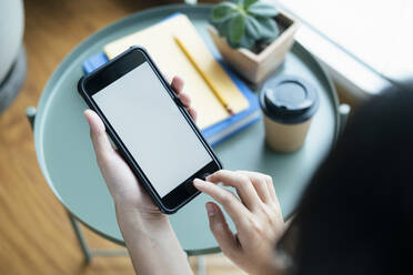 Closeup hands using smartphone mockup at the office desk. - CAVF63711