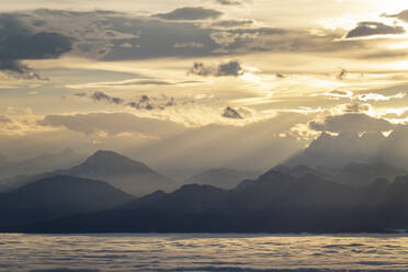 View of the Alps at sunrise, in the foreground Lake Geneva cloudy - CAVF63960