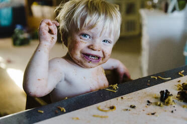 Toddler spaghetti mess at the table - CAVF64175