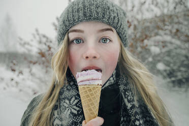 Beautiful girl eating ice cream - CAVF64278