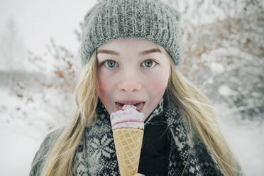 Beautiful girl eating ice cream - CAVF64279