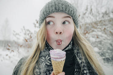 Beautiful girl eating ice cream - CAVF64280