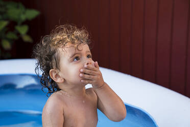 Baby girl in paddling pool - JOHF01954