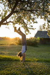 Girl doing handstand - JOHF01969