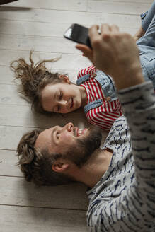 Father and daughter taking selfie - JOHF01993