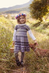 Young girl with dog walking in nature - XCF00260