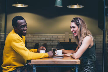 Couple having fun in a coffee shop - CJMF00051