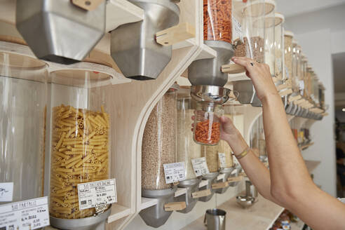 Close-up of woman shopping in packaging-free supermarket - SUF00624