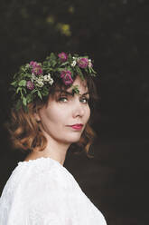 Portrait of woman with flower wreath on her head - EYAF00527
