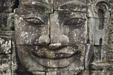 Carved face at Angkor Wat, major historical landmark of Cambodia - CAVF64760