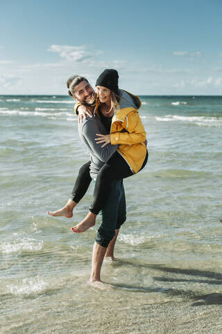 Happy couple at the beach stock photo