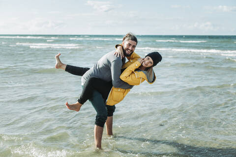 Happy couple at the beach stock photo