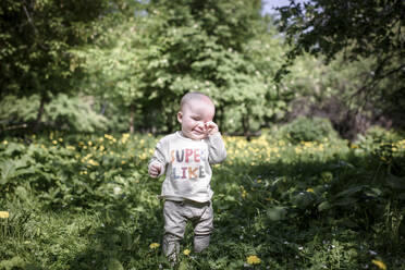 Portrait of cute baby boy in the park - EYAF00559