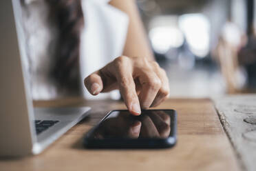 Close up woman hand press on mobile phone. - CAVF64883