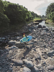 Surfer with sup surfboard at river - CAVF65021