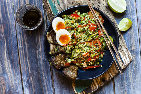 Thai style fried broccoli rice (shredded broccoli) with beef slices, eggs, and spicy sauce (ketogenic diet, paleo diet, low carb) - SBDF04022