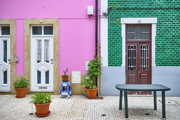 Portugal, Porto, Afurada, Front view of colorful houses on peaceful day - MRF02233