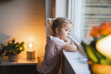 Girl looking through window - JOHF02214