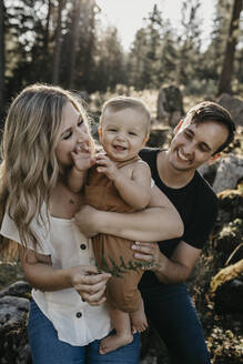 Happy family with little son on a hiking trip in a forest, Schwaegalp, Nesslau, Switzerland - LHPF01089