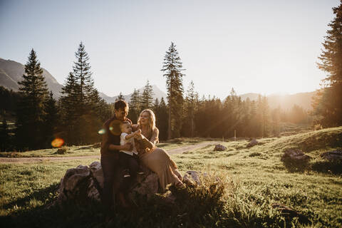 Happy family with little son on a hiking trip having a break, Schwaegalp, Nesslau, Switzerland stock photo