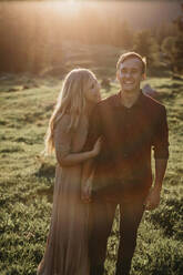 Happy young couple on a hiking trip at sunset, Schwaegalp, Nesslau, Switzerland - LHPF01115