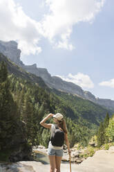 Rear view of woman enjoying the view in the mountains, Ordesa national park, Aragon, Spain - AHSF00853