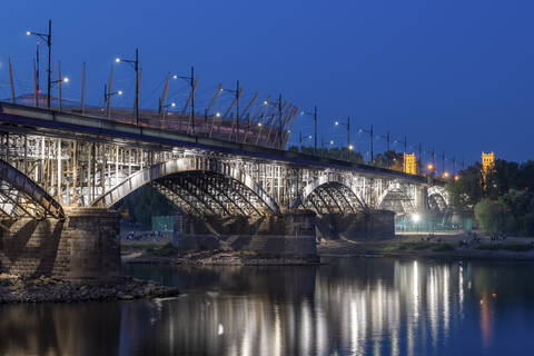 Poland, Masovian Voivodeship, Warsaw, Illuminated Poniatowski Bridge at night stock photo