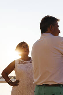 Senior couple outdoors at sunset - MOSF00002