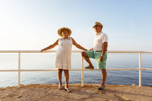 Senior couple at viewpoint at the coast, El Roc de Sant Gaieta, Spain - MOSF00004