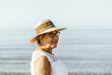 Portrait of content senior woman at the sea, El Roc de Sant Gaieta, Spain - MOSF00034