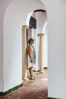 Senior tourist woman in a village, El Roc de Sant Gaieta, Spain - MOSF00037