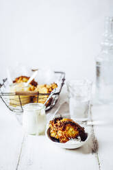 Jar of sour sauce and bowl of crunchy Jewish latkes - SBDF04061