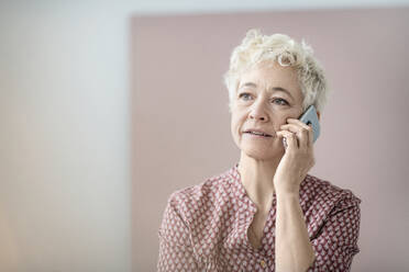 Mature woman talking via cell phone - JOHF02774