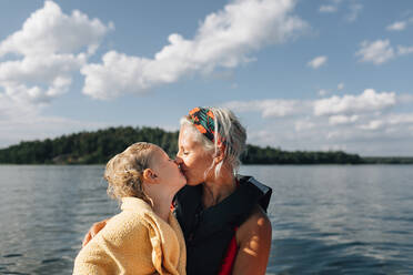 Mother with daughter on boat - JOHF02981