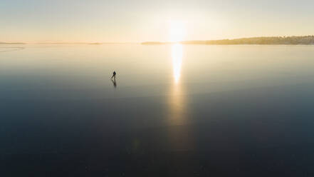 Ice skater on frozen sea - JOHF03033