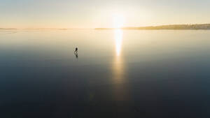 Ice skater on frozen sea - JOHF03033