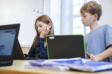 Schoolchildren using laptops - JOHF03358