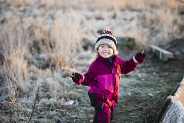 Smiling girl doing peace sign - JOHF03568