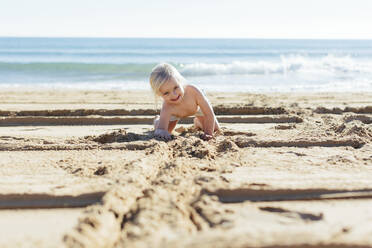 Girl playing on beach - JOHF03653