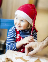 Boy and father making gingerbread - JOHF03696